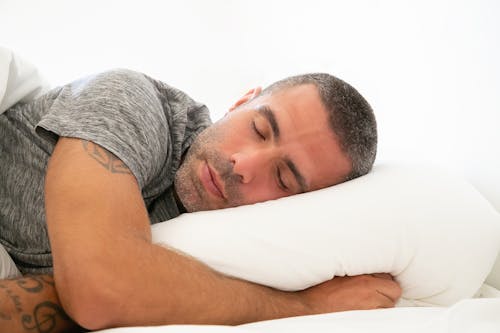 Free Man in Grey Shirt Sleeping Stock Photo