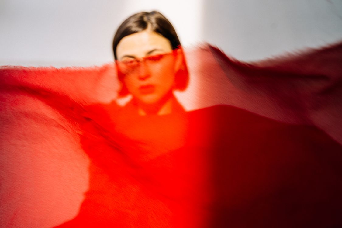 Woman Covered by a Sheet of Red Cloth · Free Stock Photo