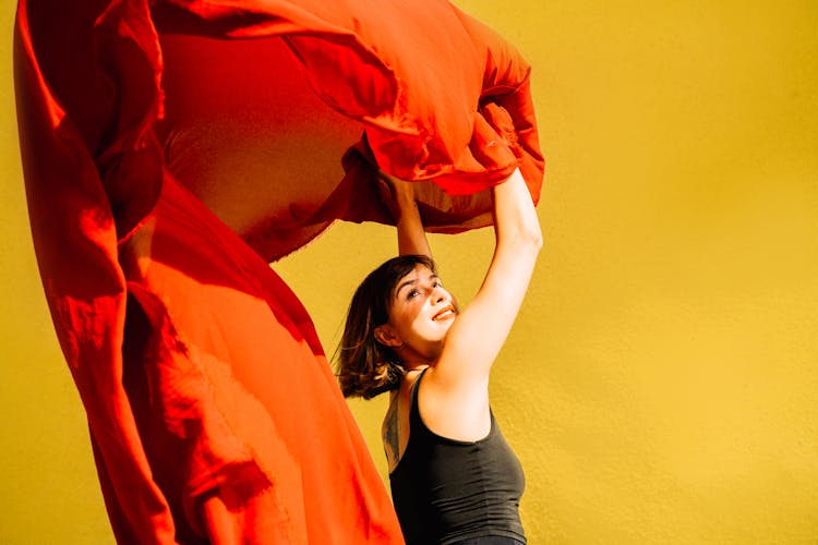 Happy Woman Holding Red Cloth