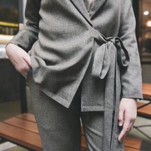 Grey tailored womenswear listing, photo by Hakim Santoso on Pexels