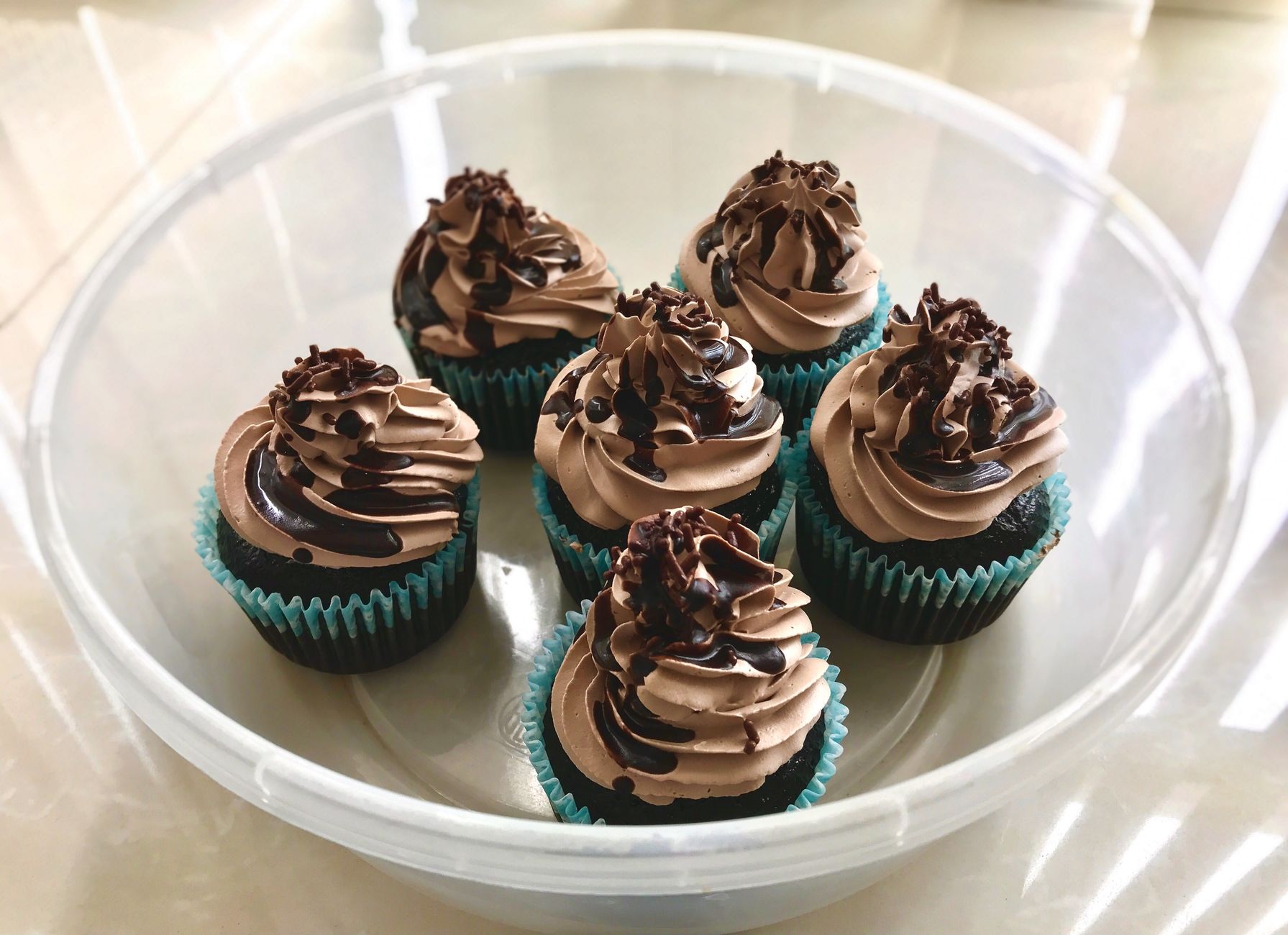 Chocolate cupcakes cooling on a rack