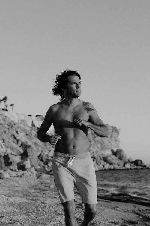 Topless Man st the Beach