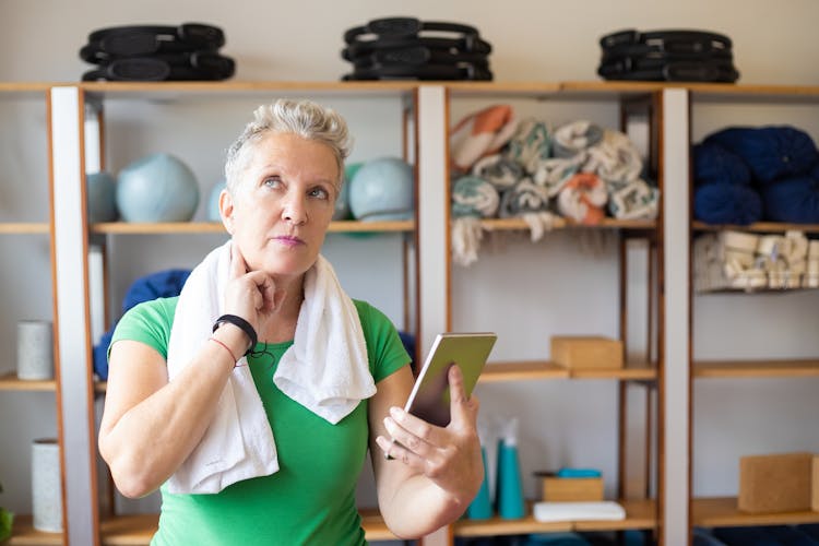 Woman In Green Shirt Checking Her Pulse