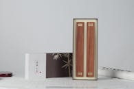 Brown Wooden Box on White Paper