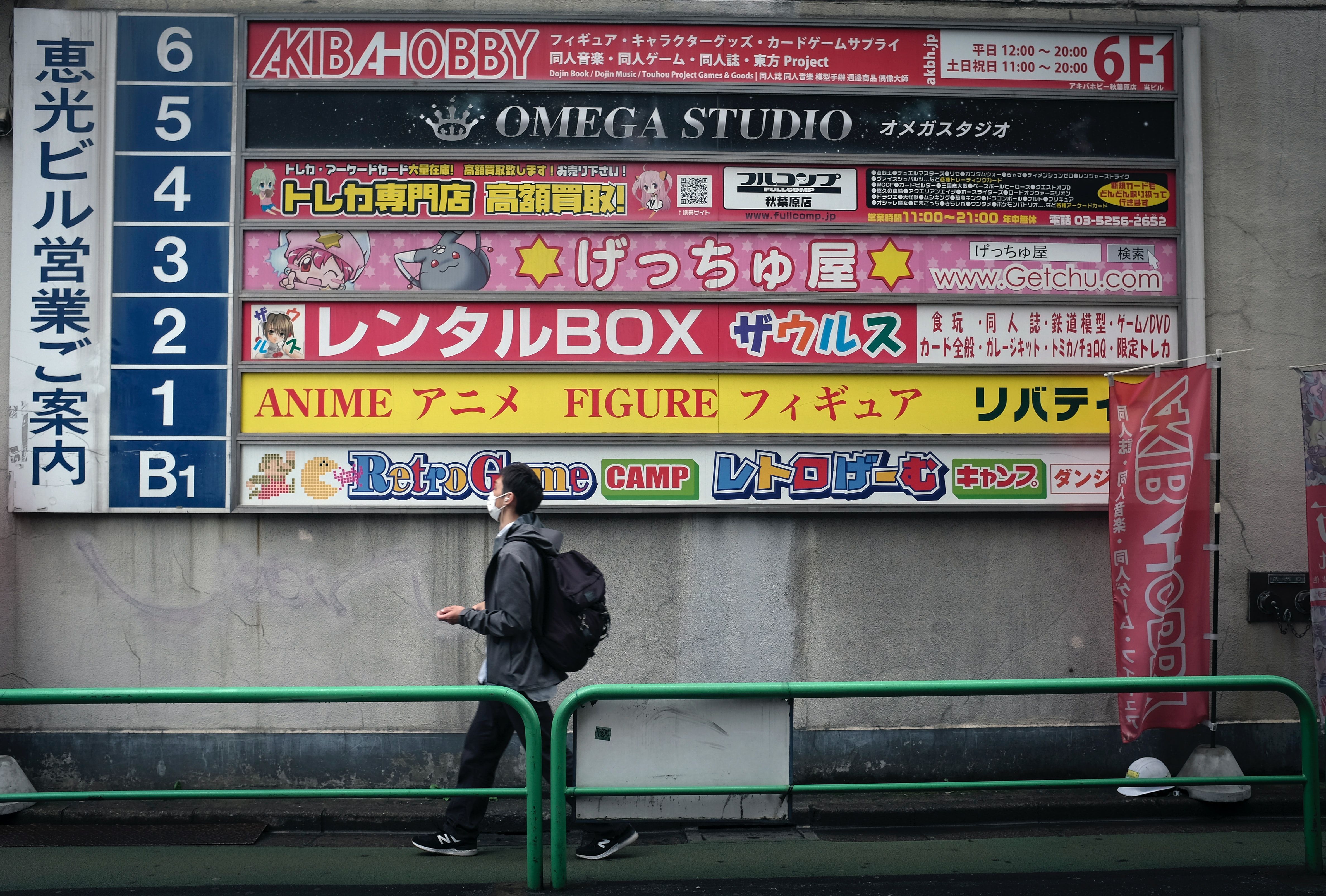 Man In Black Jacket Sitting On Green Metal Bench Free Stock Photo