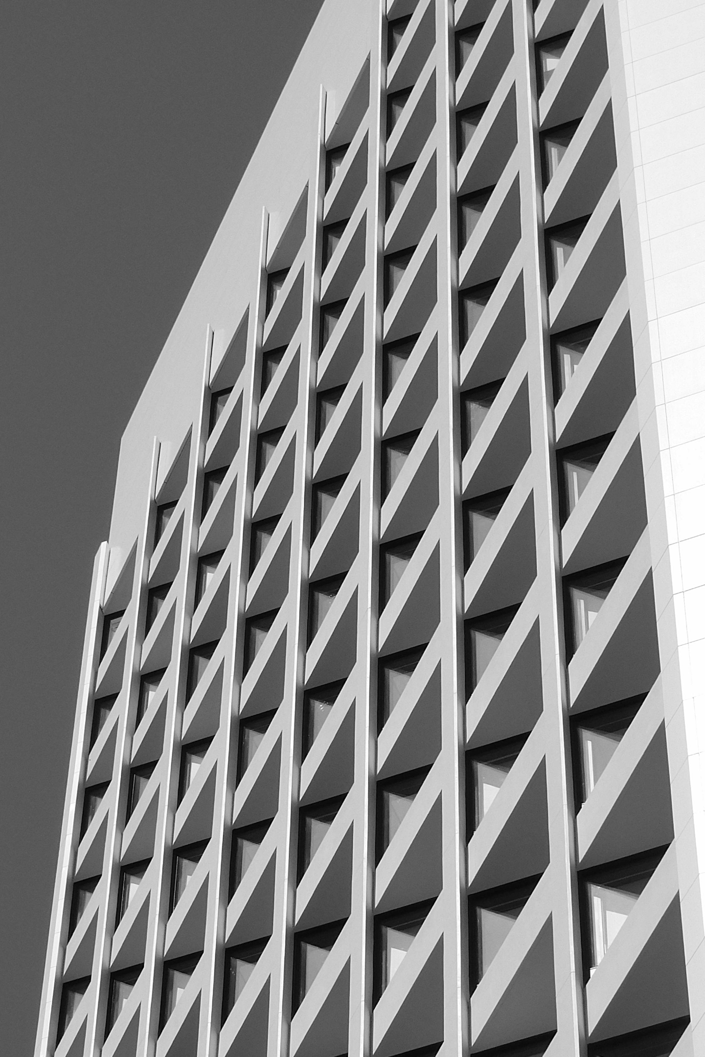 Modern geometric facade of office building · Free Stock Photo