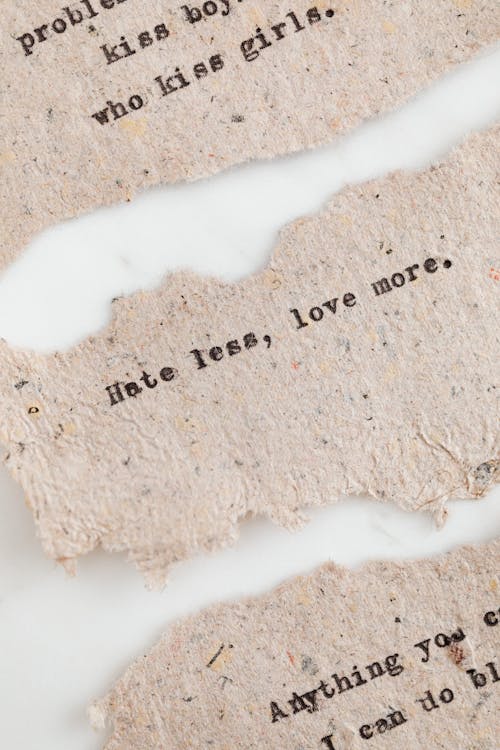 Free Quotes Written with a Typewriter on Recycled Paper Sheets Stock Photo