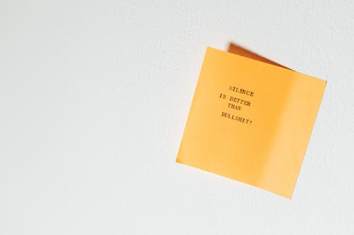 Yellow Sticky Note with a Text Written on a Typewriter 