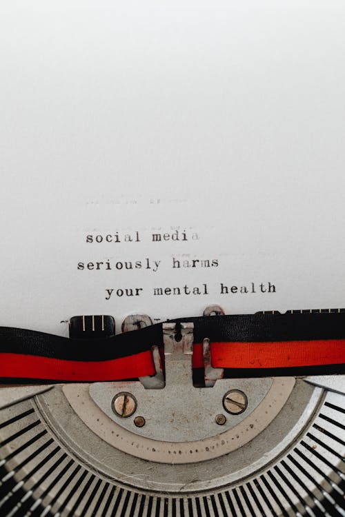 Phrase on Social Media and Mental Health Coming out of a Typewriter