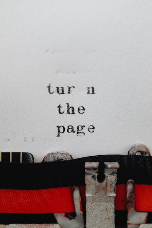 Free Close-up of a Text Written on a Typewriter  Stock Photo