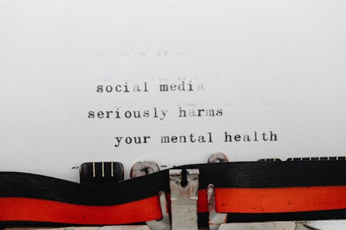 Phrase on Social Media and Mental Health Coming out of a Typewriter