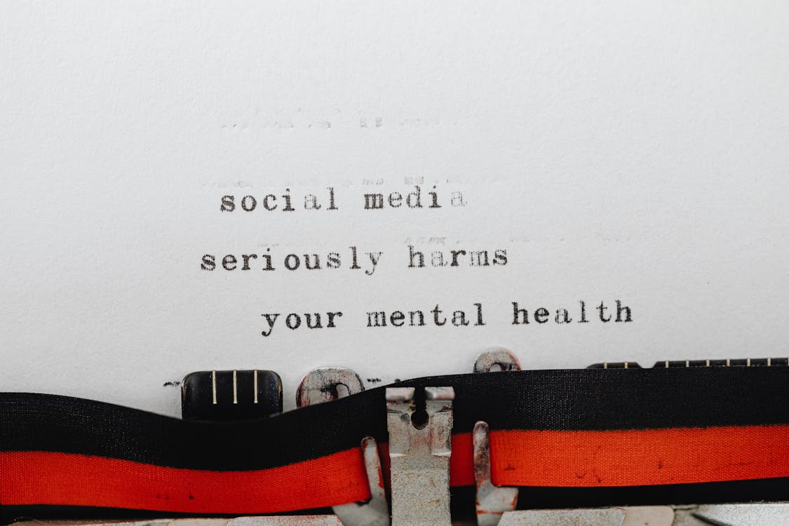 Phrase on Social Media and Mental Health Coming out of a Typewriter