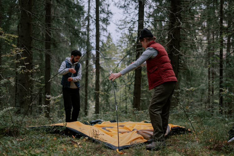 Couple Setting Up A Tent