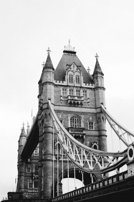 A striking black and white photo capturing the iconic Tower Bridge in London.
