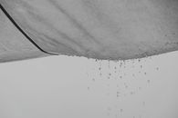 Water drops falling from abstract rag material