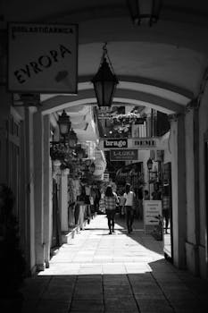 A vibrant urban street scene captured in black and white displaying local culture.