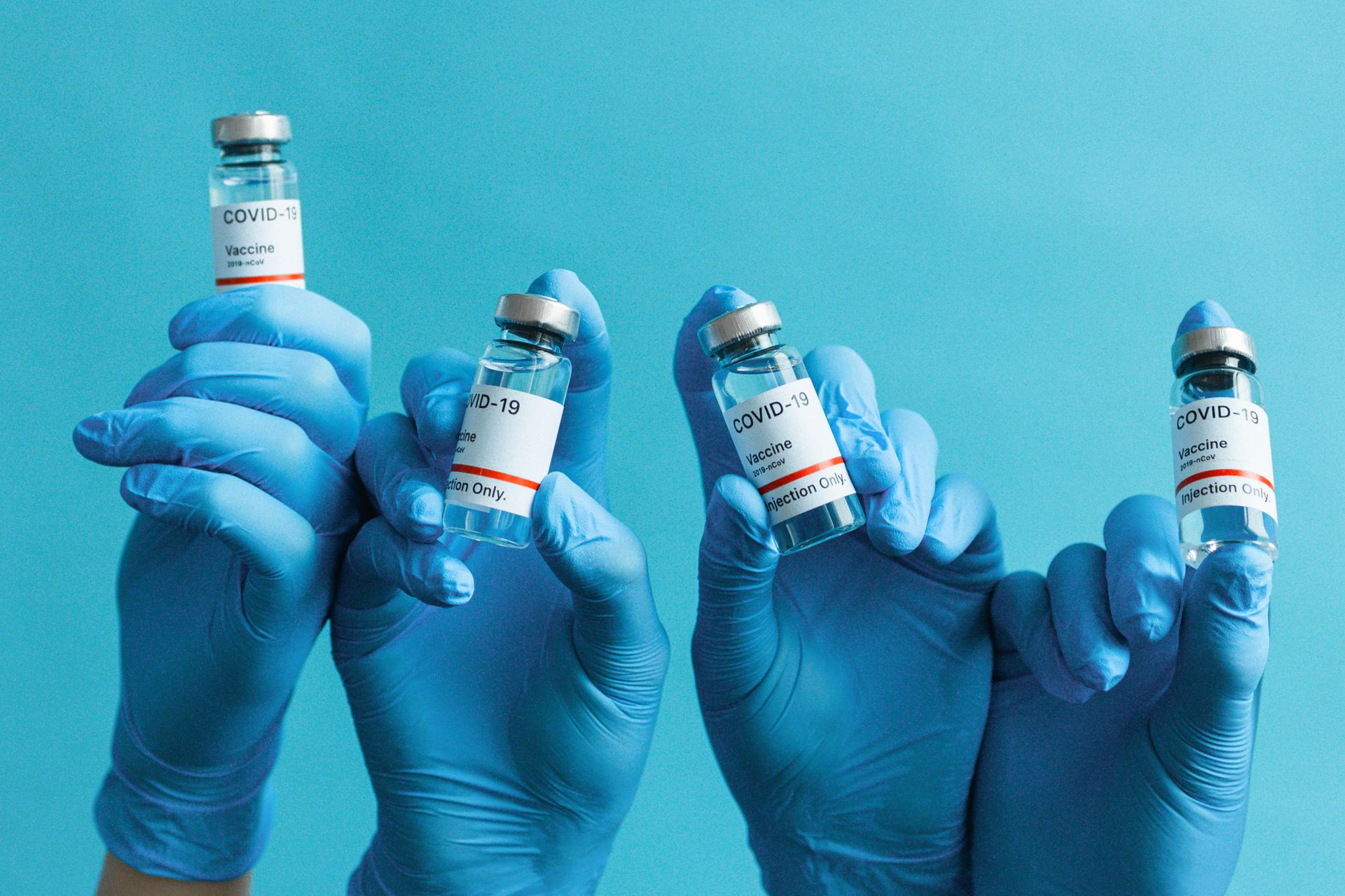 Hands Holding Vials