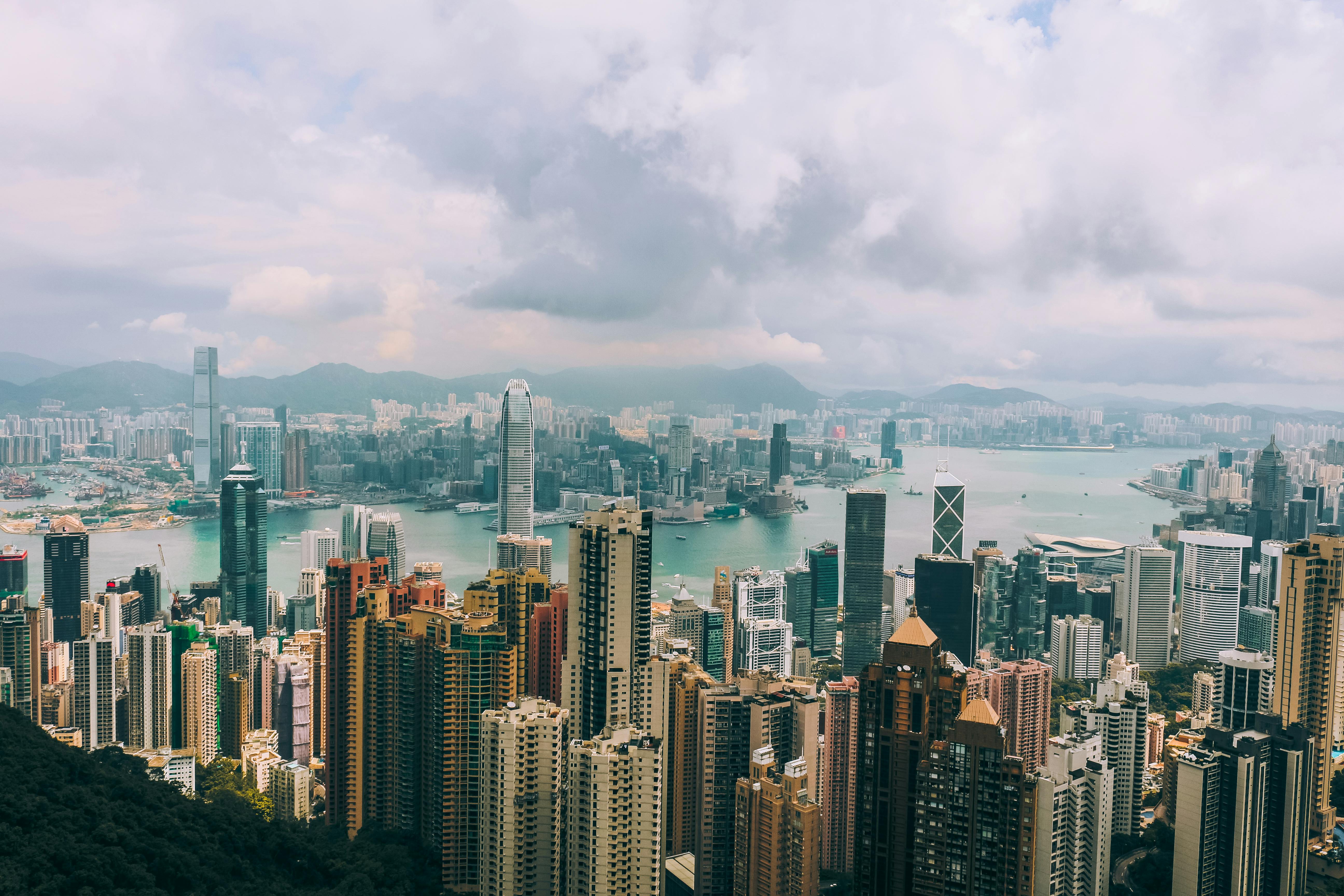 high-angle-view-of-cityscape-against-cloudy-sky-free-stock-photo