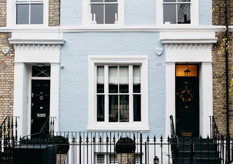 Classic Residential Building Facade With Fence