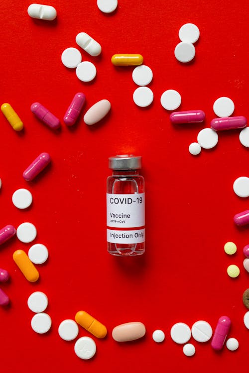 Darmowe zdjęcie z galerii z ampułka, covid szczepionka, czerwony
