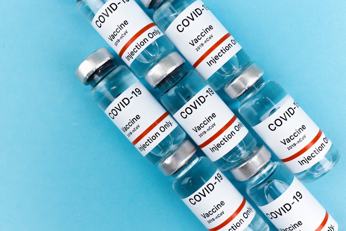 Covid Vaccines on Blue Surface