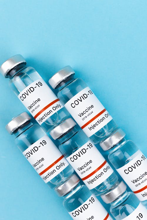 Free Vials on a Blue Surface Stock Photo