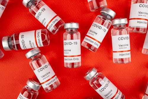 Covid Vaccines on Red Background