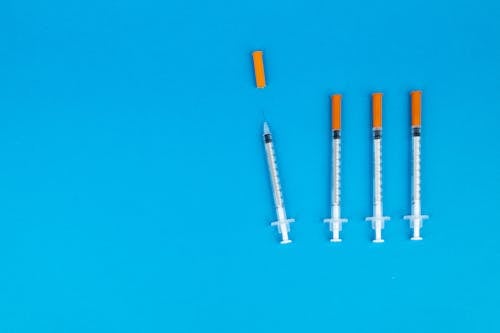 Syringes on Blue Background