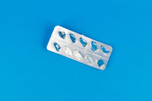Free 



Empty Pack of Pills on Blue Surface Stock Photo