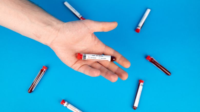 Blood sample vial in a hand