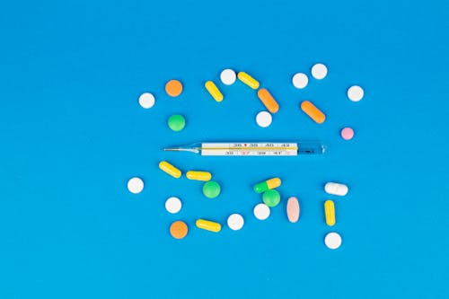 Assorted Tablets on Blue Background