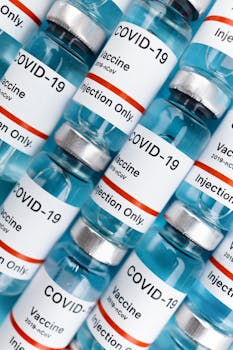 Detailed shot of COVID-19 vaccine vials labeled for injection only.