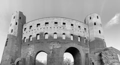Grayscale Photo of Arch Shaped Concrete Building