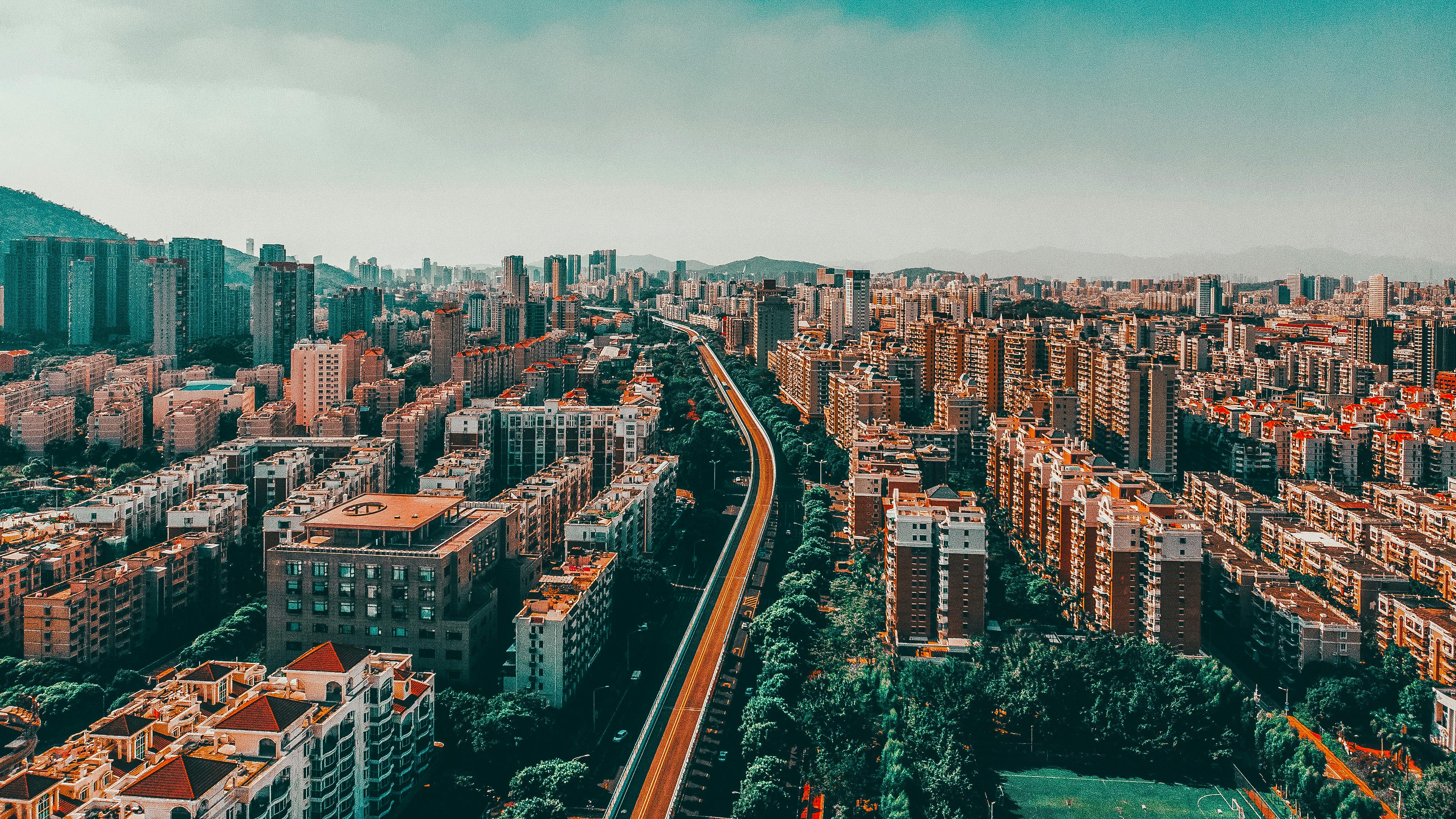 Stunning aerial view of Xiamen cityscape with modern architecture and clear blue sky.