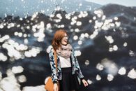 Smiling Woman Wearing Brown Scarf