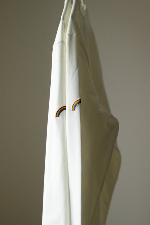 White Long Sleeve Shirt Hanging on the Rack