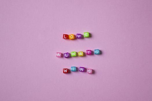 Multicolored Letter Blocks on Pink Background