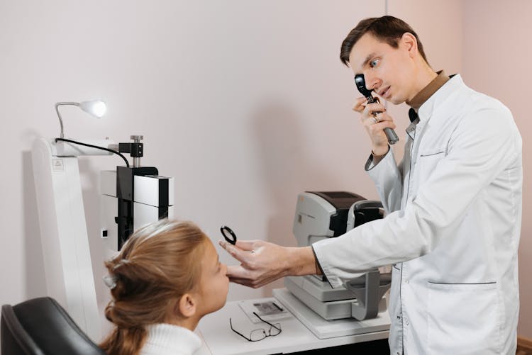 An Ophthalmologist Conducting A Vision Test