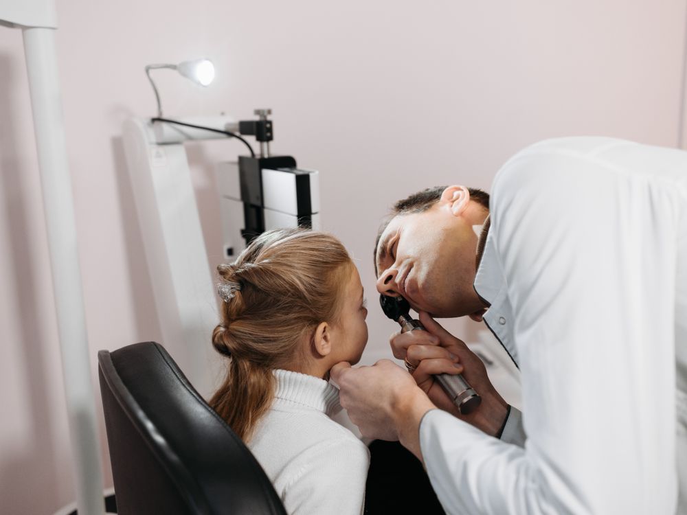 Doctor examining a girl