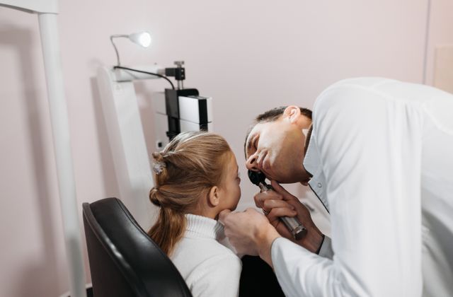 Doctor examining a girl