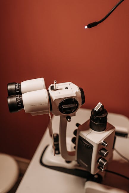 Close-up of advanced slit lamp used in eye examinations in a clinical setting.