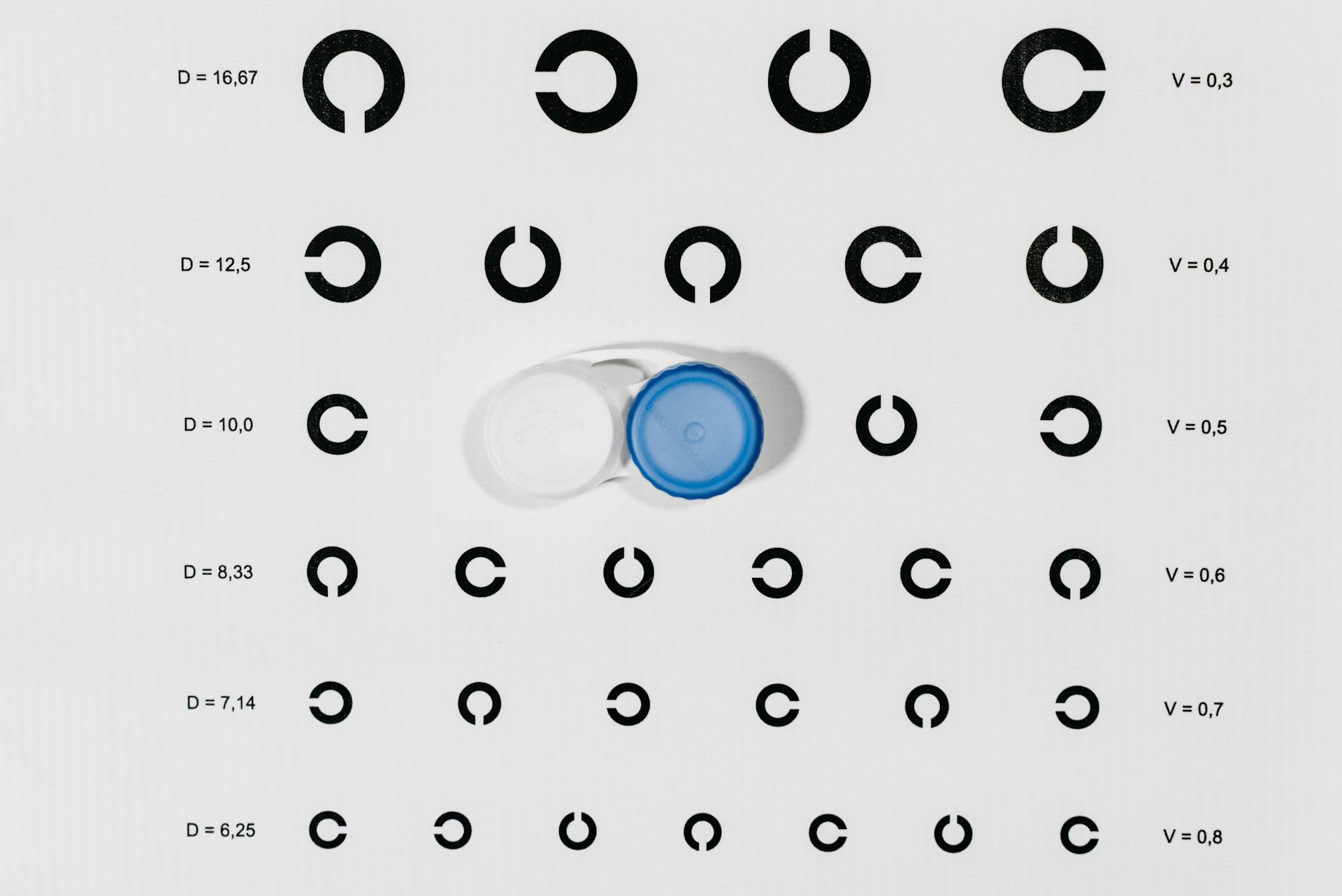 Blue and White Plastic Container on White Paper With Print