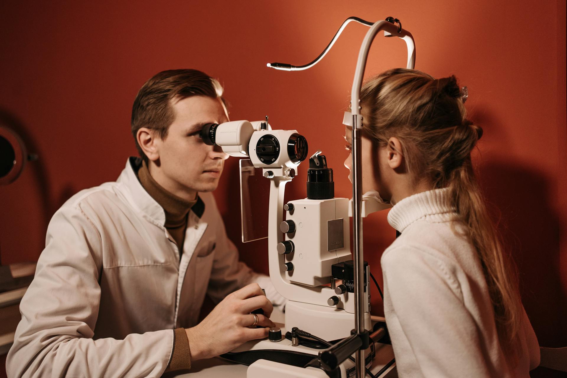 An Ophthalmologist Examining a Girl's Eye