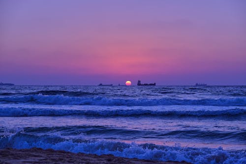 Ocean Waves Crashing on Shore during Sunset