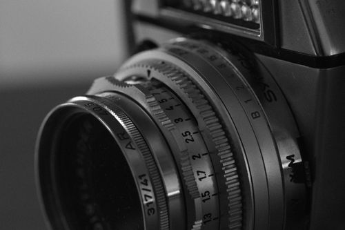 Free Detailed close-up of a vintage camera lens in black and white, highlighting its classic design. Stock Photo
