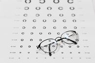 Silver Framed Eyeglasses on White and Black Polka Dot Textile