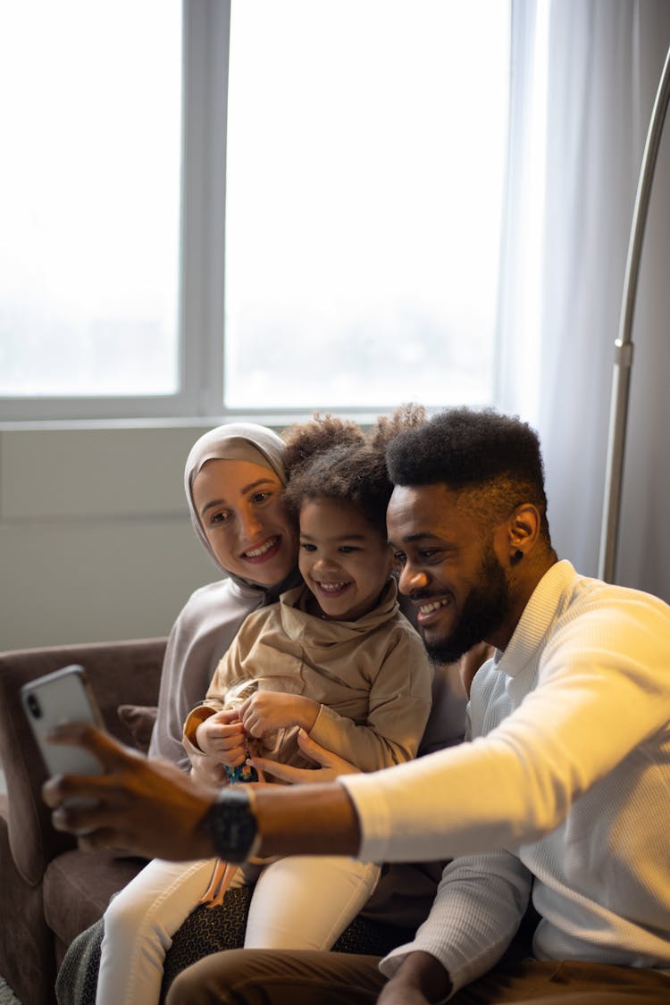 Happy Diverse Family Having Video Call With Friends