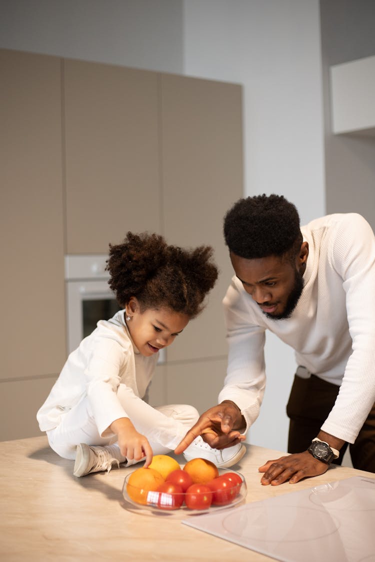 Content Black Father Spending Time With Daughter In Kitchen