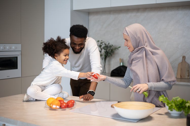 Cheerful Multiethnic Family Cooking Together At Home