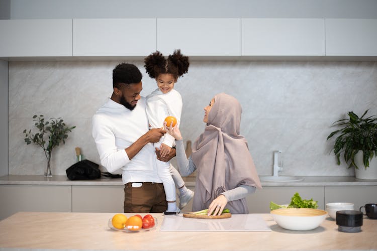 Content Diverse Family Together In Kitchen